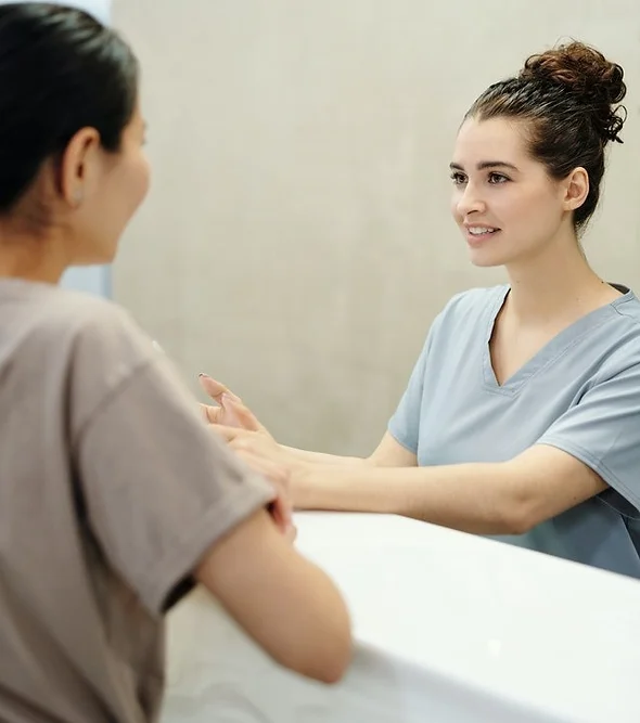 women smile in front of mirror