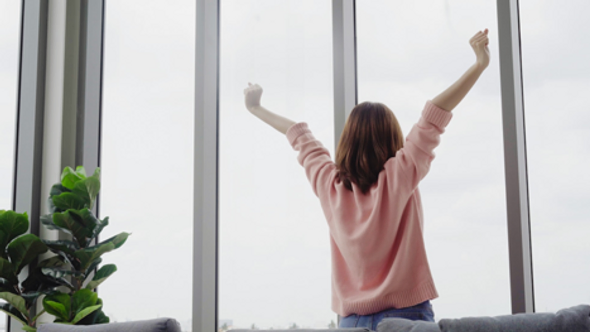 An energetic woman breathing fresh air
