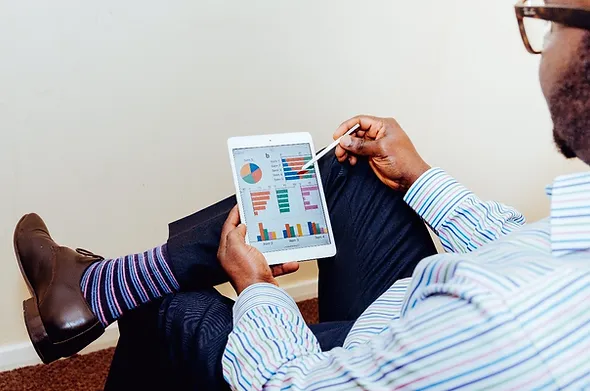 man check charts in tablet